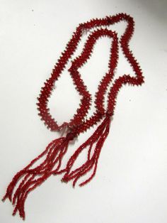 "Art Deco Crystal Bead Necklace  Lariat Tassel Necklace Out of A Gold Country California Estate A wonderful long Art Deco  flapper necklace  Red and clear seed beads in an elaborate pattern The sautoir style has tasseled ends that are looped.  44\" inches long.  This is a piece of art. The real deal out of a Gold Country Estate here in the Sierra Foothills Beautiful sparking color One small repair https://www.etsy.com/shop/BelindasStyleShop" Beaded Lariat Crystal Necklace For Gifts, Beaded Crystal Lariat Necklace For Gifts, Handmade Lariat Beaded Necklace For Party, Faceted Round Beads Lariat Necklace As Gift, Vintage Lariat Beaded Necklace As A Gift, Party Lariat Necklace With Faceted Beads, Vintage Lariat Beaded Necklaces As Gift, Vintage Lariat Beaded Necklaces For Gifts, Handmade Red Beaded Lariat Necklace