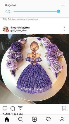 a cake decorated with purple flowers and a mermaid figure on the top is for someone's birthday