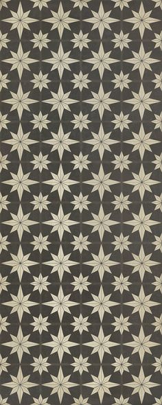 an old black and white pattern with stars on the side, as well as other patterns