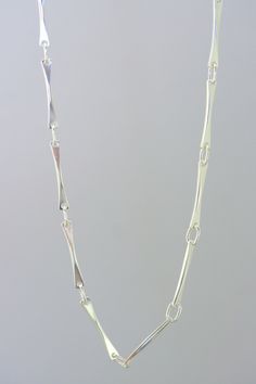 This modern style chain is made with sterling silver or solid white gold; its line are subtle and clean, original yet simple at the same time. A unique design, drawn and made by the artist for people who like simple and clean jewelry.  A ideal present  for birthday(anniversary), Mother's Days, wedding, Christmas or to offer itself to oneself! Modern Chain Necklace With Rectangular Links And Polished Finish, Minimalist Polished Link Chain Necklace, Modern Sterling Silver Chain Necklace With Rectangular Links, Modern Polished Link Chain Necklace, Modern Silver Necklace With Hooks And Links, Chain Necklace Women, Clean Jewelry, Handmade Chain, Women Chain