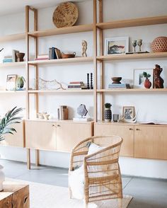 a living room filled with furniture and shelves