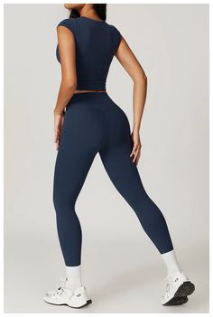 Unleash your inner slayer with the Hermera T-Leggings Set. Whether you're hitting the gym or relaxing at home, these high-waisted leggings offer both support and comfort. The full-length top has a high neckline and a shelf bra with removable padding, providing a tailored fit. Elevate your workout wardrobe with this stylish set! Product Details: Nylon/Spandex 2 Piece Set High-waist legging Top with cap sleeves, waiste length Built in shelf bra with removable padding Imported Snug Fit Elastane Leggings For Workout, Snug Fit Elastane Leggings For Pilates, Breathable Snug Fit Athleisure Leggings, Moisture-wicking Snug Fit Athleisure Leggings, Seamless Snug Fit Yoga Pants, Sporty Snug Fit Tights For Yoga, Snug Fit Elastane Yoga Pants For Workout, Moisture-wicking Snug Fit Tights For Yoga, Gym Moisture-wicking Snug Fit Leggings