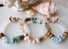 Larimar bracelets, blue beachy bracelets, seashell coastal bracelets, beachy boho bracelets, summer stacking bracelets, shell bracelets - Etsy 日本 Ocean-inspired Beaded Bracelets For Beach, Bohemian Shell Friendship Bracelets, Blue Natural Stone Bracelets For Beach, Blue Natural Stones Bracelets For Beach, Blue Natural Stone Beach Bracelets, Spiritual Stackable Beach Jewelry, Turquoise Bohemian Wrap Bracelet For Beach, Spiritual Stackable Jewelry For The Beach, Summer Beach Stackable Jewelry