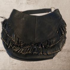 Like New Condition Perfect With No Signs Of Wear Condition And Authenticity Guaranteed Miu Miu Leather Boho With Fringe And Gold Studs Extra Large Very Roomy Leather Approximate Dimensions: 20 Inches By 14 Inches By 5 Inches Gold Tone Hardware Adjustable Single Handle Exterior Features Fringe Accents With A Stud On Each Fringe Top Zip Closure Interior Features 1 Zip Pocket Western Style Miu Miu Bag, Fringe Top, Gold Studs, Western Style, Western Fashion, Miu Miu, Zip Pockets, Extra Large, Limited Time