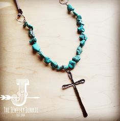 Large Copper Cross Pendant is featured on a blue turquoise necklace The necklace adjusts from 30" up to 36" in length with the self-tie closure Cross is approx. 4" in length Although your item will resemble the photo, each piece is created by hand, so no two are identical.Thank you for visiting The Jewelry Junkie! Adjustable Turquoise Cross Jewelry, Artisan Turquoise Adjustable Lariat Necklace, Artisan Turquoise Lariat Necklace Adjustable, Artisan Adjustable Turquoise Lariat Necklace, Bohemian Turquoise Cross Necklace, Handmade Turquoise Cross Necklace, Adjustable Cross Necklace For Festivals, Adjustable Beaded Turquoise Lariat Necklace, Adjustable Beaded Lariat Turquoise Necklace