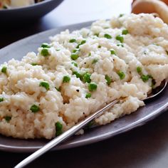 a plate with rice and peas on it