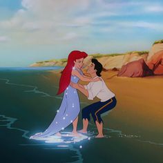 the little mermaid and prince hugging on the beach