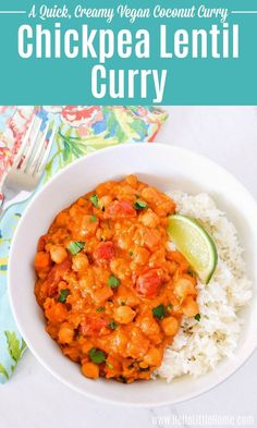 a white bowl filled with chickpea lentil curry next to rice and lime