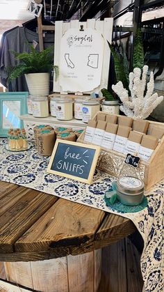 a table that has some items on it and is set up in front of a sign