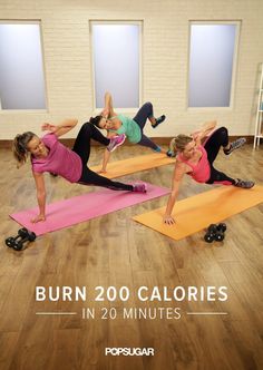 a group of women doing exercises on rollers in a room with windows and wooden floors