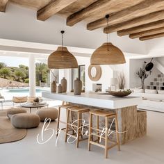 an open concept living room and dining area with white walls, wood beams and natural materials