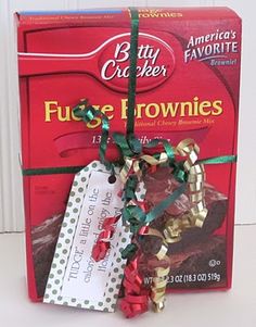 a package of fudge brownies tied up to a string with christmas decorations on it