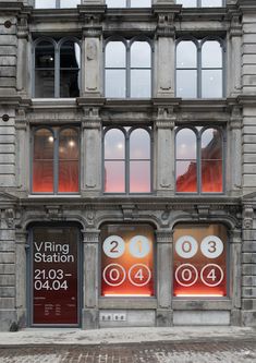 an old building with windows and signs on the front door that read vying station