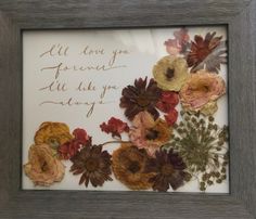 a frame with some flowers on it and a handwritten message in the middle that says, all love you forever