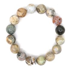 The understated beauty of our natural jasper bracelet, featuring soothing neutral tones reminiscent of untouched landscapes. Each stone tells its own story, perfectly complemented by sterling silver diamond rondelles for a touch of subtle elegance.   Gemstones in their natural form are imperfect as such, no two stones are alike which add to the character and the beauty of the stone.  One-of-a-kind. Made in Canada. We passionately believe in sourcing and using the best quality gemstones for our collections. In our opinion, a little bit of wear and tear is a sign that your jewelry is loved and has been enjoyed! However, we appreciate that you will want to protect your special piece and keep it looking good for as long as possible.   Here's what we recommend - Avoid contact with water, perfum Earthy Jasper Beaded Bracelets With Natural Stones, Earthy Jasper Beaded Bracelet With Natural Stones, Earthy Beaded Bracelets With Natural Jasper Stones, Earthy Jasper Gemstone Bead Bracelets, Earthy Jasper Gemstone Beads Bracelet, Everyday Hand-strung Agate Beaded Bracelets, Earthy Jasper Round Bead Bracelets, Everyday Sterling Silver Beaded Bracelet With Natural Stones, Everyday Agate Bracelets With Natural Stones