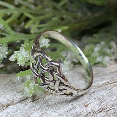 TAKE AN ADDITIONAL 20% OFF THE ALREADY REDUCED SALE PRICE - ADDITIONAL 20% IS DEDUCTED AT CHECKOUT with code SAVE20 Solid Sterling Silver A unique design combining the traditional elements of the Celtic knot with an open knotwork design for comfortable everyday wear - solid sterling silver. Ring face is over 1/4" wide Choose from sizes 6-9 Hallmarked 925