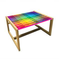 a multicolored coffee table with wooden legs on an isolated white background for display