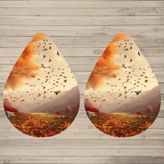 an image of a pair of pears with autumn leaves on them