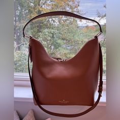 Measurements 13.12" H X 5.4" D 12.04"W (Bottom) Strap Drop: 10.5" Handle Drop: 10.0" Crossbody Strap Drop: 16.5" Zip Closure No Dust Bag Included Interior: Front Slip & Back Zip Pockets Pebbled Leather - Warm Gingerbread Lining: Two Way Spade Jacquard Lining Style Number K8140 Kate Spade Brown Tote Shoulder Bag, Kate Spade Brown Shoulder Bag With Double Handle, Kate Spade Brown Shoulder Bag For Errands, Kate Spade Shoulder Bag With Gold-tone Hardware For Errands, Kate Spade Bucket Shoulder Bag For Everyday Use, Kate Spade Bucket Shoulder Bag With Detachable Strap, Kate Spade Bucket Shoulder Bag For Travel, Kate Spade Brown Shoulder Bag With Detachable Handle, Kate Spade Bucket Bag For Everyday Use