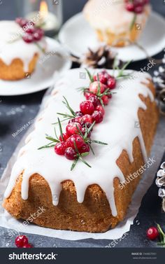 a cake with icing and cranberries on it