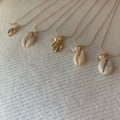 "Gold plated 17\" necklace. The chain is adjustable. Very versatile and great for layering." Pika Shell Necklace, Shell Necklace Aesthetic, Gold Beach Jewelry, Cowrie Shell Jewelry, Fresh Water Pearl Necklace, Surf Jewelry, Water Pearl Necklace, Cowrie Shell Necklace, Seashell Jewelry