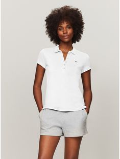 Tommy Hilfiger women's polo. Our classic polo is a key part of the Hilfiger heritage—as relevant today as is was in 1985. This version is designed in a trim, flattering fit from comfortable stretch cotton.  Material: 97% Cotton, 3% Elastane. Tommy Hilfiger Short Sleeve T-shirt For Summer, White Cotton Tommy Hilfiger T-shirt, Tommy Hilfiger Store, Tommy Hilfiger Relaxed Fit Cotton T-shirt, Tommy Hilfiger Cotton T-shirt With Text Print, Tommy Hilfiger Cotton Logo T-shirt, Tommy Hilfiger Women, Cotton Polo, Stretch Cotton