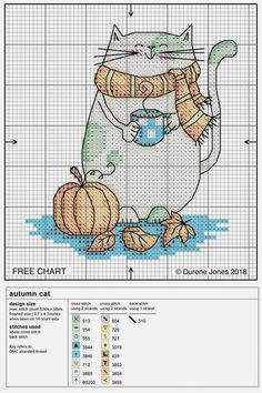 a cross stitch pattern with a cat holding a cup and pumpkins on the ground