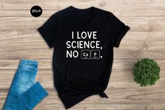 Looking for a unique gift for the science lover in your life? Look no further than our i love science, no cap. shirt! This fun and geeky tee is perfect for anyone who loves learning about the world around them. Plus, it's made from high quality materials so you can be sure that it will last long. Whether you're giving it to a teacher as a thank you gift or just want to show your love for science, this shirt is definitely the perfect choice.  DESIGN COLOR  * Black text/design will be printed on Light color shirts * White text/design will be printed on Dark color shirts  HOW TO ORDER  * Select the Shirt Size & Color * Select the quantity * Click Add to Cart * For multiple items go back to the listing and repeat the steps  SIZE AND MATERIAL * The unisex t-shirts are true to size. Relaxed fit Science T Shirt Design, Science Teacher Shirts, Science Shirts For Teachers, Science Tshirt, Camp Shirt Designs, Science Teacher Tshirts, Science Teacher Shirt, Geek Shirts, Science Shirts