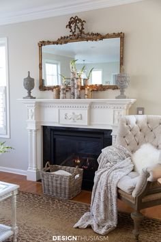 a living room with a fireplace and mirror