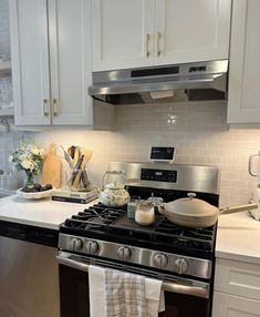 a stove top oven sitting inside of a kitchen