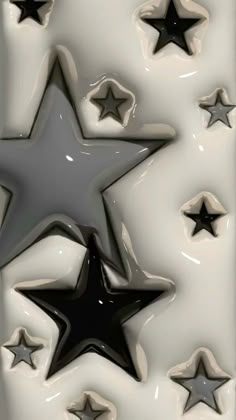 several black and white stars on a white background