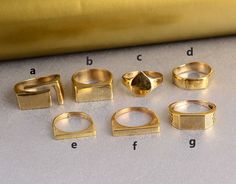 "Signet Gold Rings, Signet Rings, Men Signet Rings, Custom Rings, Brass Rings, Personalized Signet Rings, Handmade Jewelry, Christmas Gift Size:- All Size Available In Variation Metal:- Brass MUST READ....👇 5 stars is my shop's priority. So contact me before leaving any negative review. I am here only for my dear customers. it is poor Etsy manners to Leaving a negative review without conversation with your seller. If you are not satisfied with my jewelry, then please contact me, I will solve your problem. ❥ Customers' satisfaction is our biggest priority, please contact us with any questions/queries for future or existing orders, and we will do our best to make sure you are happy with your order. ❥Please make sure to add the correct address during checkout. You can return your purchased i Mens Pinky Rings, Gold Ring Men, Gold Rings For Men, Rings Signet, Pinky Rings, Mens Pinky Ring, Rings Men, Brass Rings, Signet Ring Men