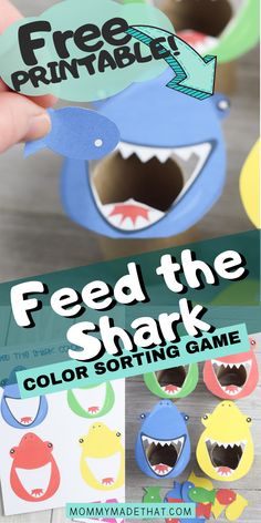 a hand holding a paper shark game with the text feed the shark color sorting game