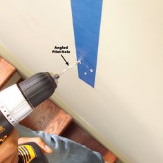 a drill is being used to fix a hole in the wall