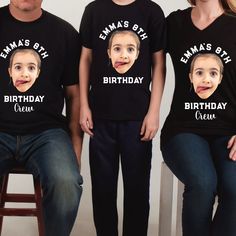 three people wearing t - shirts with the faces of two men and one woman on them