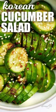 cucumber salad with sesame seeds in a white bowl