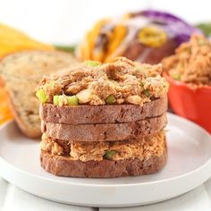 three pieces of bread stacked on top of each other in front of an orange bowl