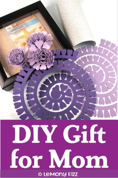 a purple box with paper flowers on it and the words diy gift for mom