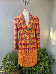 "Vintage 80s suit skirt & blazer by Anne Klein orange red plaid tweed knobby mohair wool size 6. Fully lined in good condition. Made in USA Measurements  Skirt waist 28\" Hips 40\" Length 20\" Jacket shoulders 17\" Sleeves 23\" Bust 38\" Waist 32\" Hips 38\" Length 28\"" Retro Plaid Wool Blazer, Retro Long-sleeved Tweed Outerwear, 80s Suit, Vintage Plaid Blazer With Pockets, Vintage Tailored Wool Skirt Suit, Vintage Single-breasted Long Sleeve Skirt Suit, Western Brown, Mohair Wool, Anne Klein