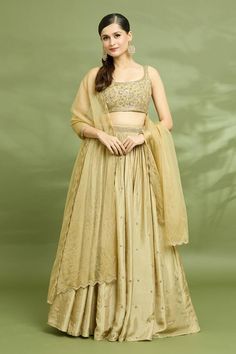 Gold lehenga with an attached cancan and butti and aari embroidery. Comes with a padded blouse and a dupatta. - Aza Fashions Sleeveless Chinon Lehenga With Zari Work, Traditional Sleeveless Lehenga With Gota Work, Traditional Lehenga With Gota Work, Traditional Sleeveless Raw Silk Lehenga, Sleeveless Silk Lehenga With Dupatta, Sleeveless Art Silk Traditional Wear For Wedding, Sleeveless Chanderi Lehenga With Gota Work, Unstitched Wedding Lehenga, Unstitched Sleeveless Lehenga For Wedding