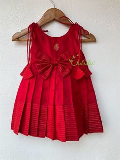 Age: 0-2year size available New born dark red pure silk knot frock for cradle ceremony. The Yoke portion of frock made with soft silk with Paisley design and the skirt portion is made on plain silk fabric. The dress is fully lined with soft cotton and the stitches are concealed. So your little princess feels comfortable in this frock. A man's daughter is his heart💓. Just with little feet's walking out in the world. Chitralie by Lekha Meera proudly announcing the launch of our new kids ethnic we Red Cotton Party Sets, Red Silk Festive Dress, Red Festive Dress For Ceremony, Festive Satin Dress For Festivals, Red Cotton Formal Dresses, Red Silk Dress For Festive Occasions, Baby Girl Dresses Traditional, Red Silk Dresses For Festivals, Silk Dresses For Festivals And Celebrations