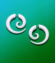 These tribal fake gauge earrings fit regular pierced ears but give the appearance of a stretched piercing. These small spirals are elegant everyday earrings, measuring 1 inch and are handmade from beautifully polished salvaged water buffalo bone. Hand carved to fit regular pierced ears. Thanks for checking out these earrings! I also make beautiful wood and bone jewelry in my shop, and I would love for you to stop back and view my other jewelry. - Judi Back to the SHOP: http://www.primaloriginals Fake Gauge Earrings, Gauge Earrings, Fake Gauges, Bone Earrings, Plug Earrings, Horn Jewelry, Bone Jewelry, Body Modification, Gauged Earrings