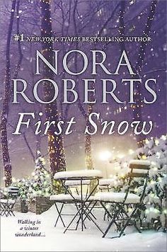 the cover of first snow by nora roberts, with two chairs and tables covered in snow