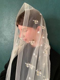 A beautiful cathedral veil is made of delicate  silky lace. Gorgeous mantilla of  ivory. Edges lace mantilla chapel are processed by beautiful sewing that gives tenderness and refinement. Lovely mantilla veil. SIZE:58 inches x 21 inches(147 cm x 53 cm )  Chapel veil can be made in other sizes by custom order. Lace mantilla suitable for orthodox mantilla, bridal veils, catholic mantilla,mass, First Holy Communion and Confirmation, mothers day gift Instructions for use: Wash by hand and dry on a smooth surface. Do not iron. Cream Dupatta For Spring Wedding, Spring Wedding Cream Dupatta, Traditional White Veil, Spanish Veil Mantilla, Italian Lace Veil, Spanish Lace Veil And Flower Crown, Bridal Floral Crown + Mantilla, Chapel Veil Catholic, Kyiv City