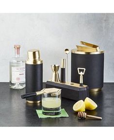 a table topped with bottles and containers filled with liquid