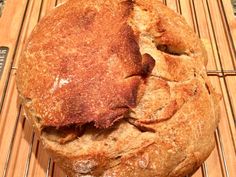 a loaf of bread sitting on top of a cooling rack