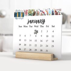 a calendar sitting on top of a wooden stand