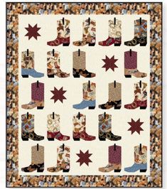 a quilt with cowboy boots on it and stars in the middle, as well as a border