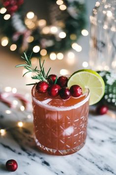 A photo of a  Cranberry Rosemary Gin Smash a Christmas Gin Cocktails Winter Cocktail Recipes, Holiday Margaritas, Pomegranate Drinks, Cranberry Simple Syrup, Cinnamon Sugar Rim, Butternut Bakery, Pomegranate Margarita, Winter Cocktails Recipes