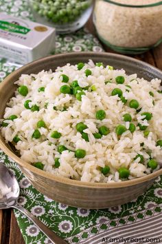 a bowl filled with rice and peas on top of a table